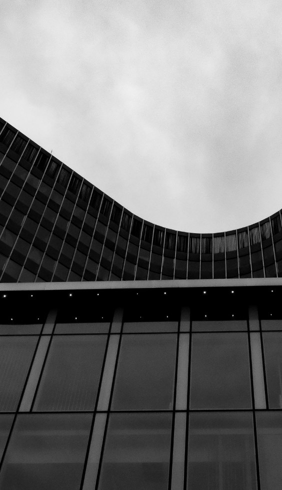 Curved concrete tower facade in black and white